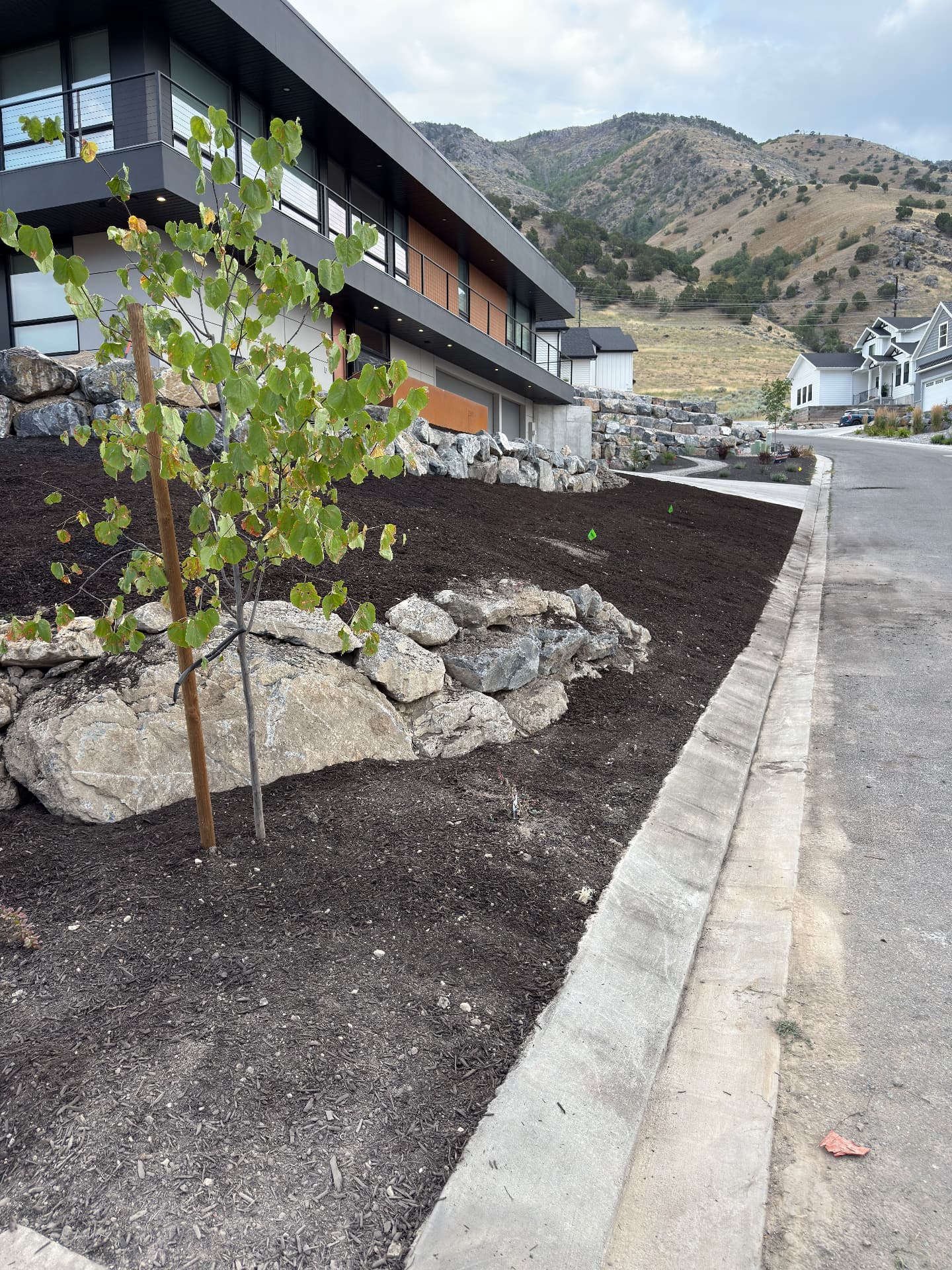 Completed hillside landscaping by Starline Dirtworks in Cache Valley